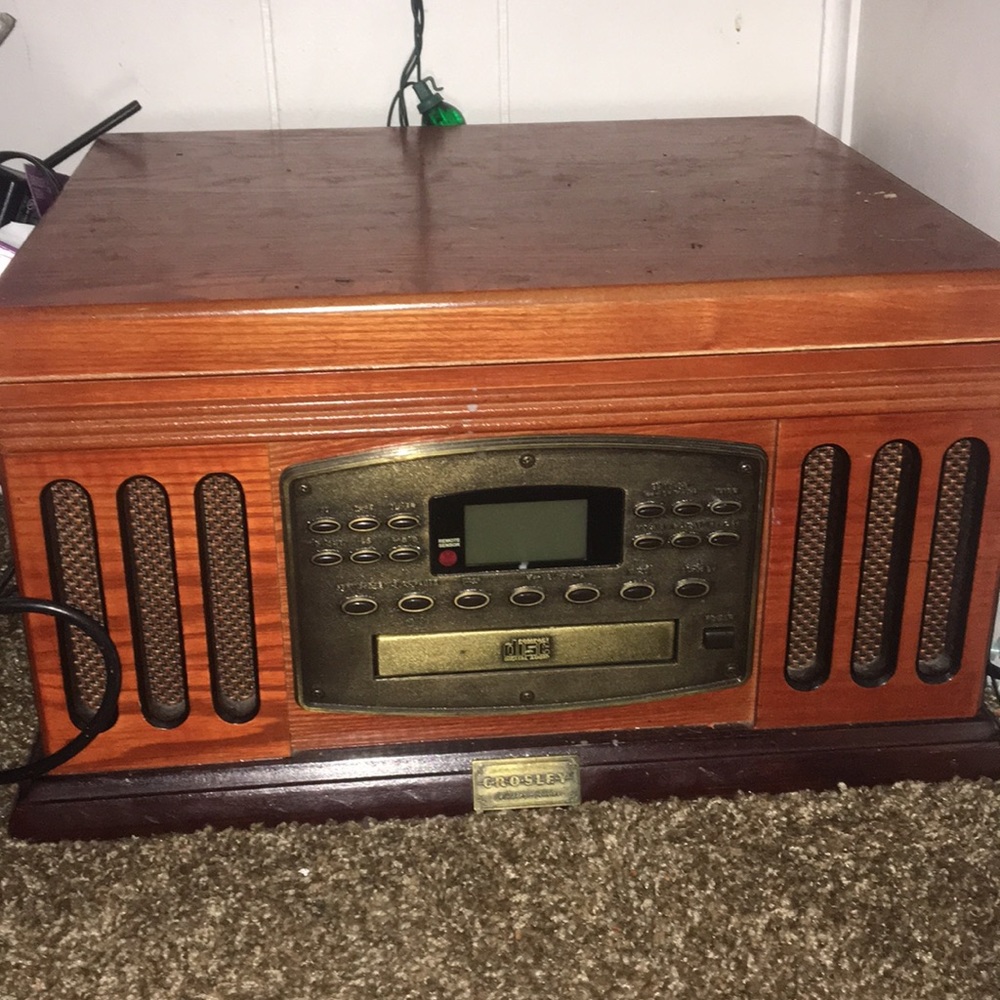 This is a record player has CD player, radio,